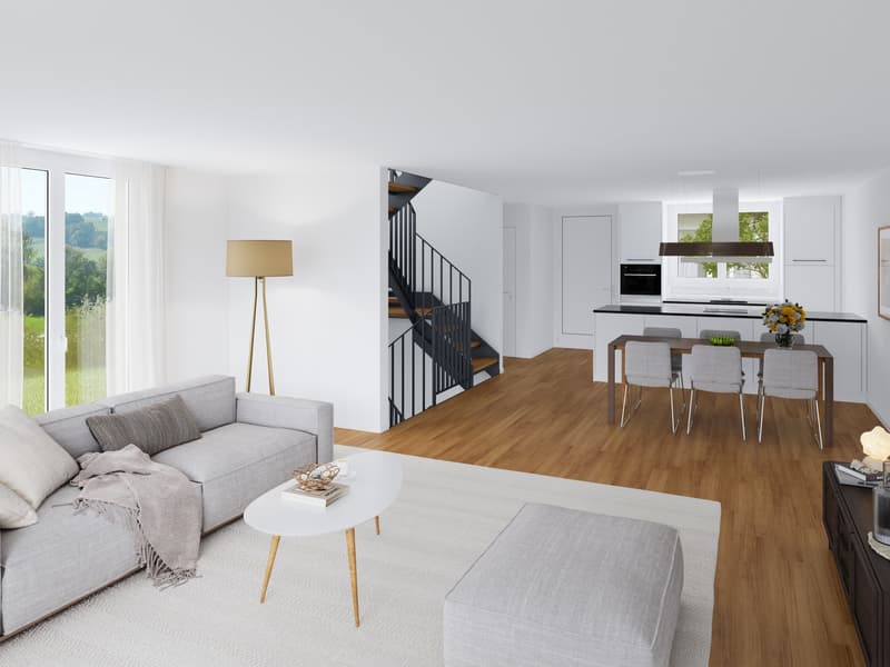Open-concept living room and kitchen with large windows, hardwood floors, gray sofa, coffee table, and dining area with table and chairs. Staircase with black railing leads to upper level.
