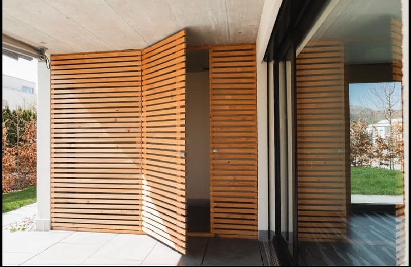wooden folding doors, concrete floor, glass wall, balcony