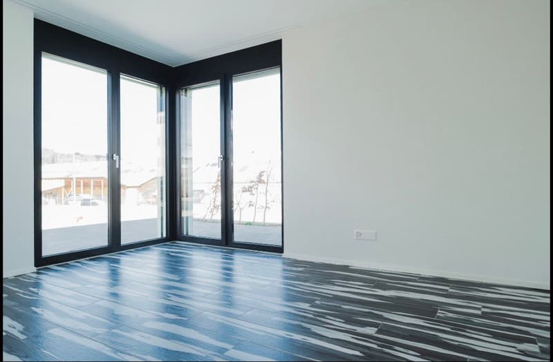 empty room, large windows, white walls, blue and black tiled floor