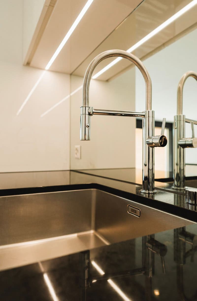 modern kitchen sink, stainless steel, double faucet, under cabinet lighting