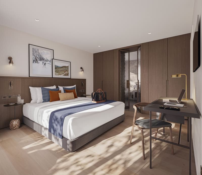 Wooden floor, large bed, bedhead with cabinets, desk, chair, lamps, table