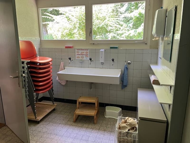washroom, sink, toilet, windows, shelf, chair, basket