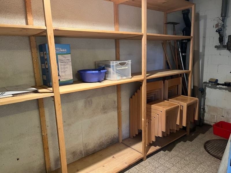 wooden shelves, plastic boxes, bowls, wooden chairs, tools