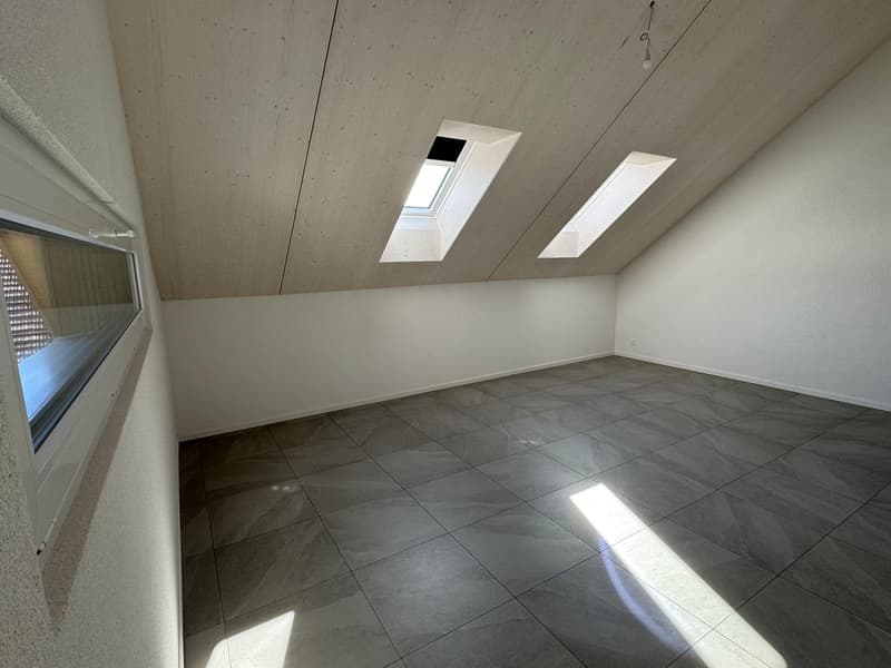 empty room, ceiling with wooden paneling, three windows, gray tiled floor, light coming through windows