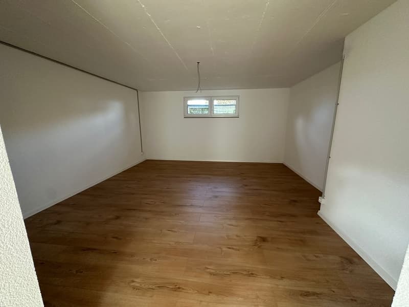 empty room, wooden floor, white walls, small window