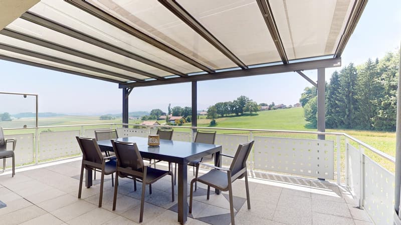 outdoor dining area with a covered porch, table and chairs, scenic countryside view