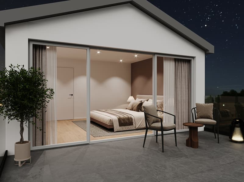 Spacious bedroom with large windows, sliding glass doors leading to a balcony or terrace, hardwood flooring, and modern furniture including a bed, chairs, and side tables.