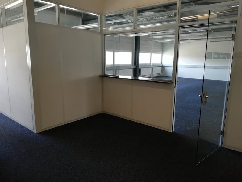 glass partitions, white walls, carpeted floor, open door, glass door, reception area