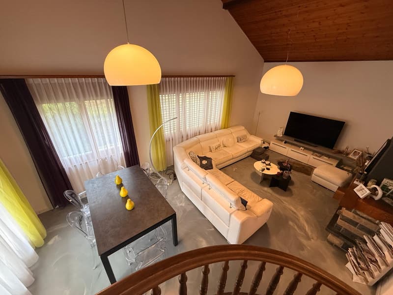 white sofa, black table, lamps, television, fireplace