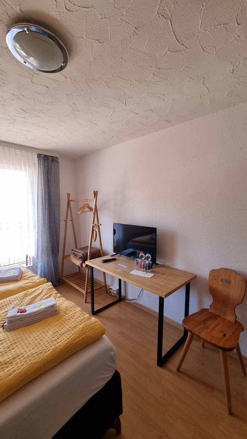 Double bed, wooden desk, wooden chair, flatscreen TV, power outlets, 2 hangers, 2 windows