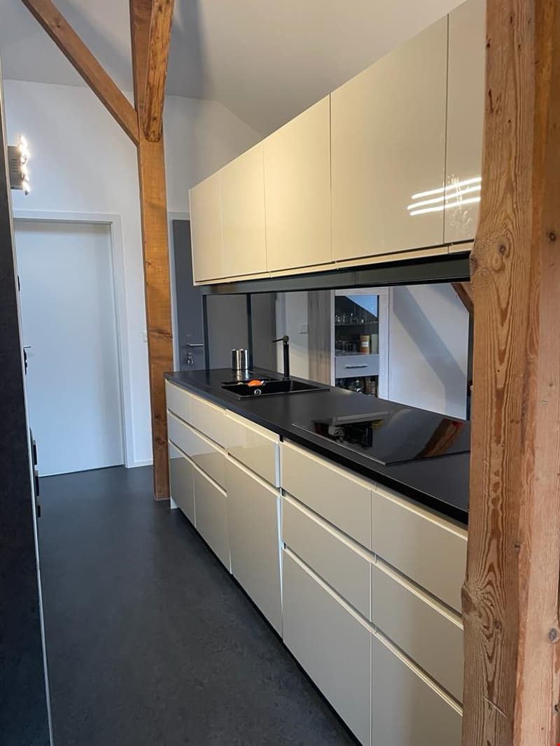 Modern kitchen, sleek cabinets, marble countertops, gas stove, double sink, dishwasher, under-cabinet lighting