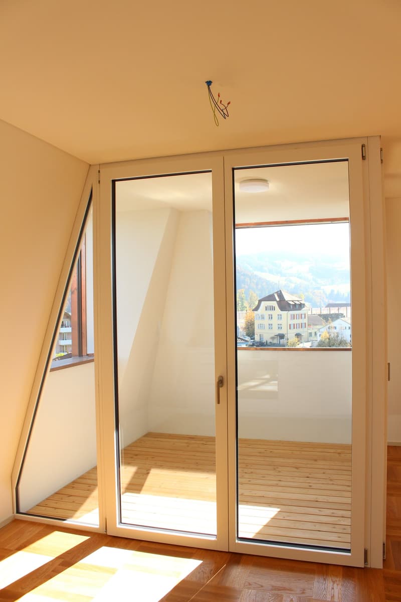 sliding glass doors, wooden floor, balcony, view of mountains
