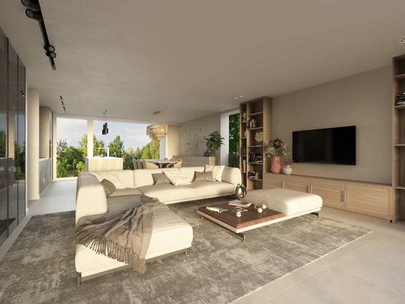 Spacious living room with large windows providing a scenic view, beige sectional sofa, wooden coffee table, built-in shelving unit, and a large wall-mounted TV