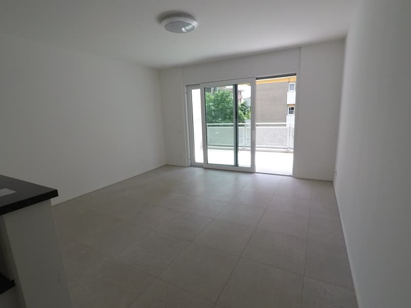 empty room, sliding glass doors, balcony, tiled floor