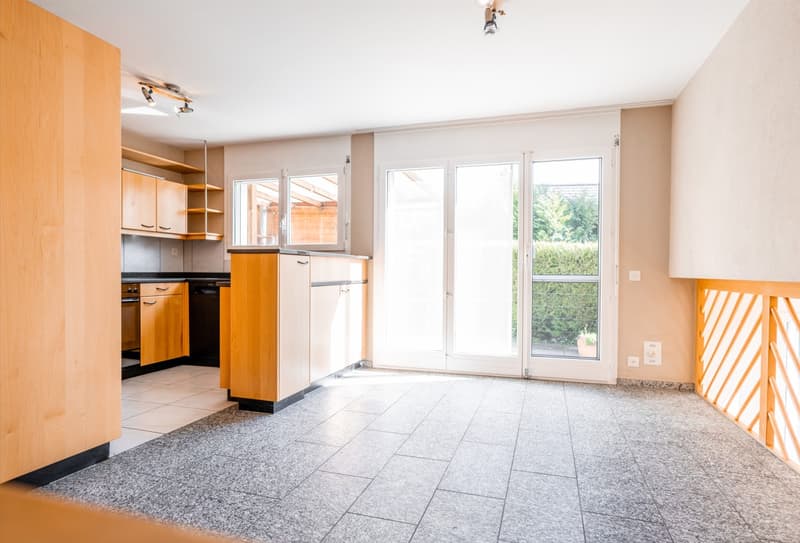 modern kitchen with wooden cabinets, tiled floor, large windows, sliding door, electrical outlets, ceiling lights