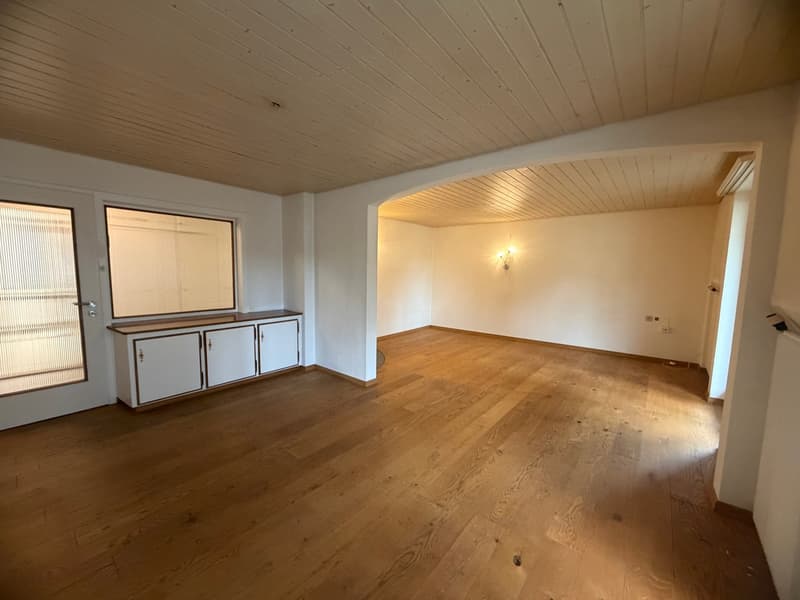 empty room, wooden floor, white walls, large windows, white cabinet, ceiling lamp