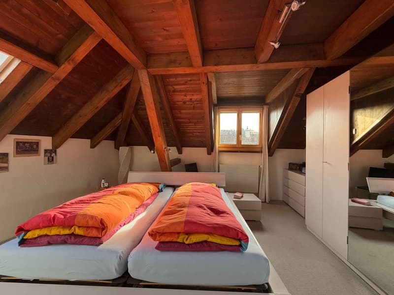 two double beds, wooden ceiling, windows, wooden drawers, mirrors