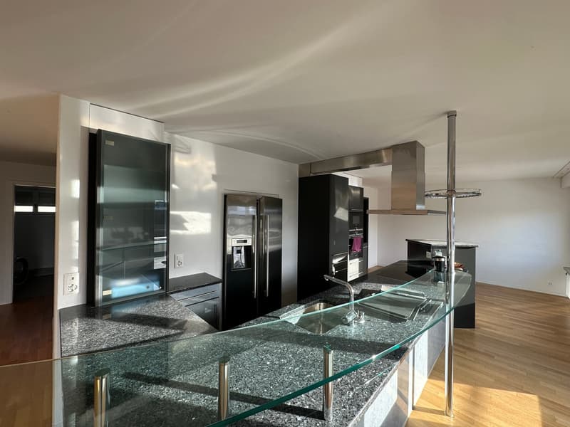 glass countertop, marble flooring, stainless steel appliances, open kitchen, wooden floor