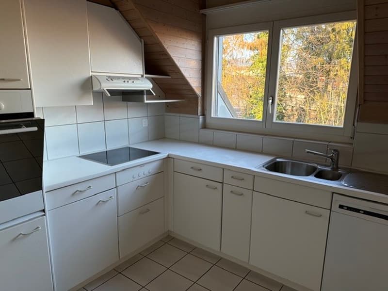 white cabinets, tiled floor, gas stove, oven, sink, dishwasher, window