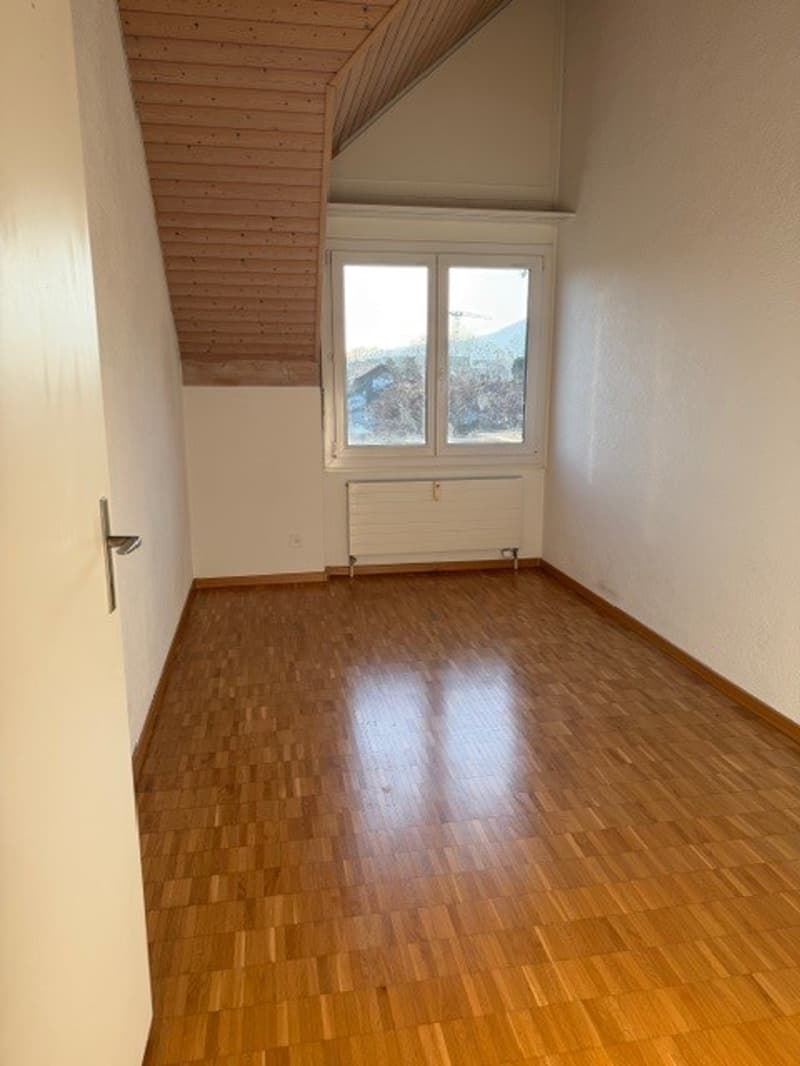 empty room, wooden floor, white walls, wooden ceiling, window, radiator