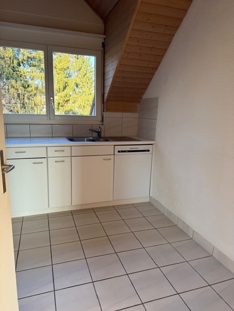 kitchen with white cabinets, tiled floor, sink, dishwasher, window