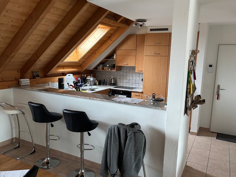 kitchen with bar counter, wooden beams, wooden cabinets, tiled floor, sink, stove, refrigerator, ceiling lamp, window