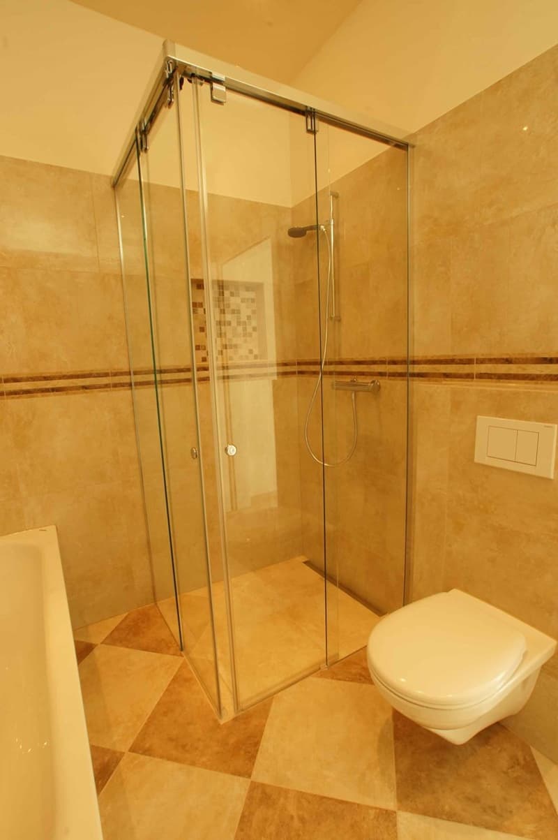 bathroom with glass shower, bathtub, white toilet, tiled floor