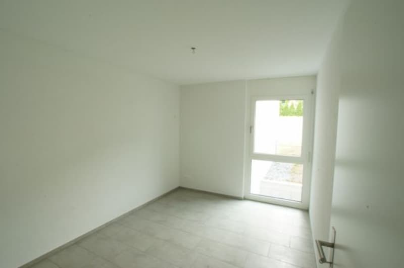 empty room, white walls, tiled floor, large glass door