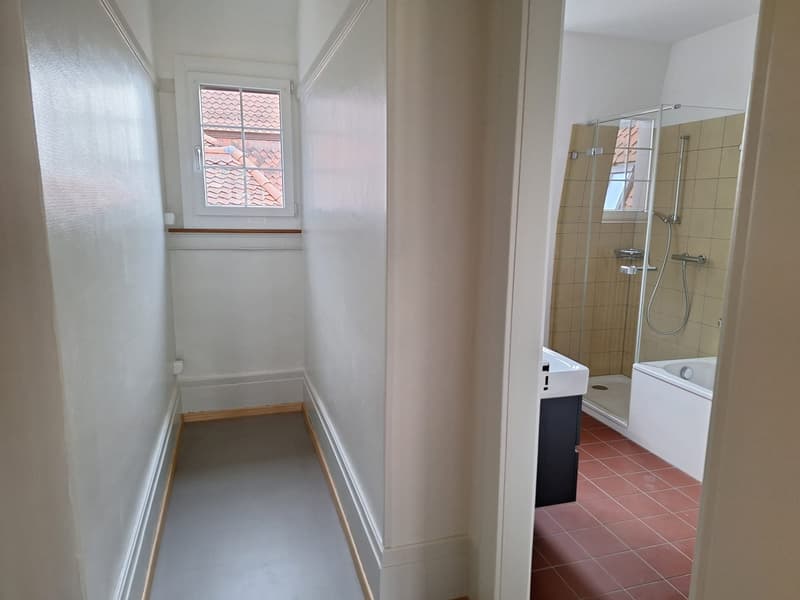 Bathroom with shower, bathtub, sink, and window