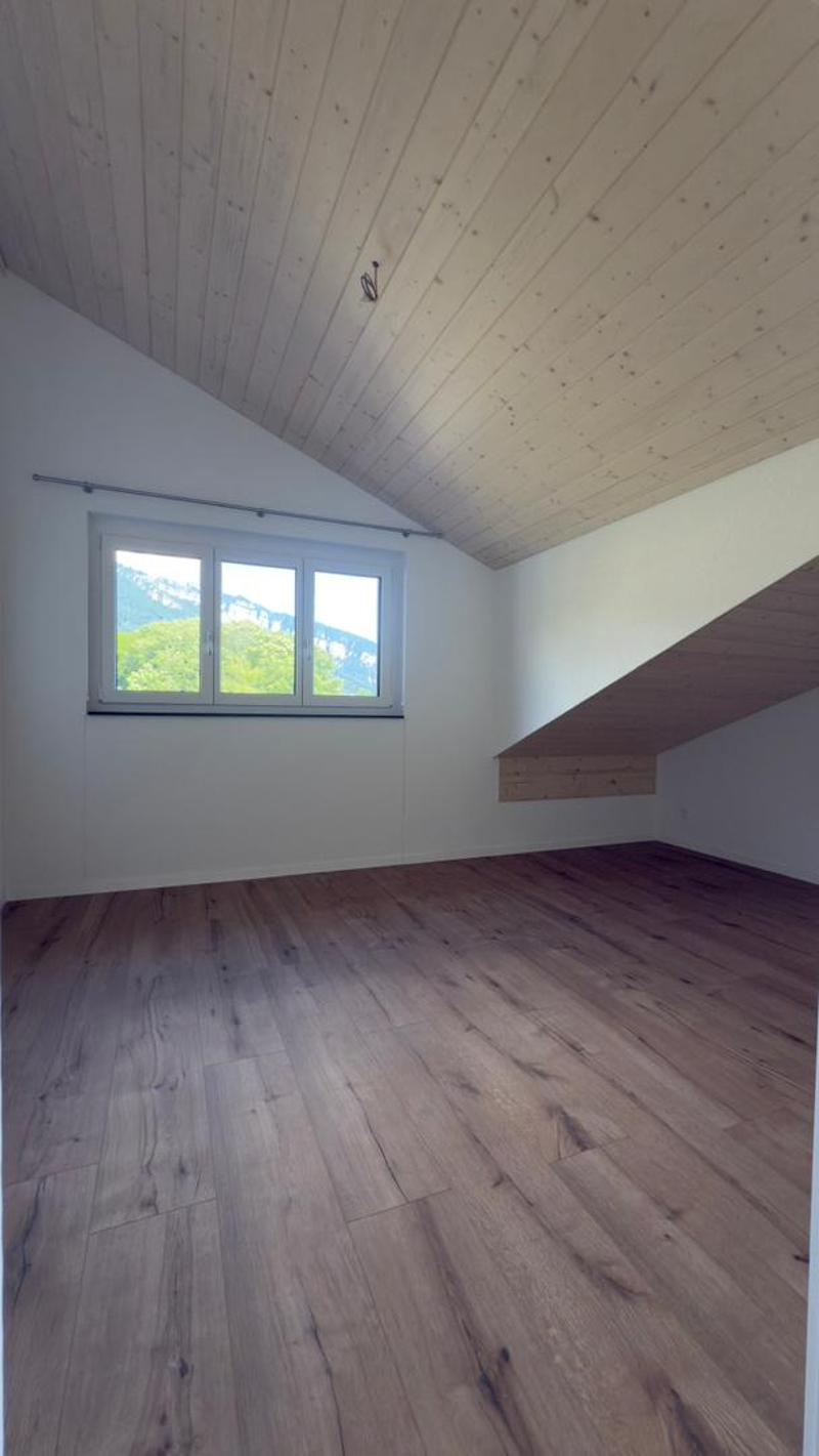 empty room, wooden floor, white walls, window with view