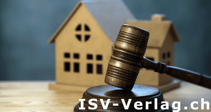 Auction gavel in front of a model house
