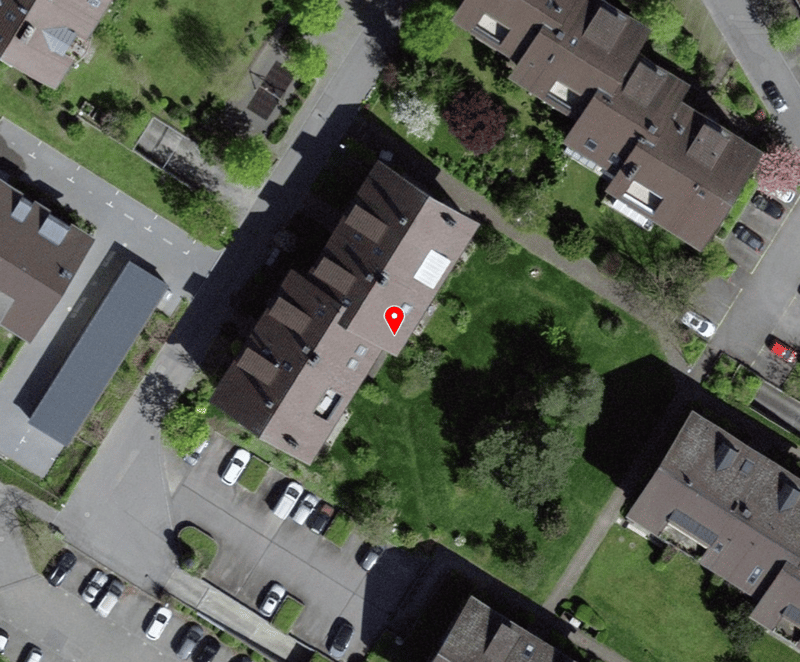 multistory house with parking lot and garage
