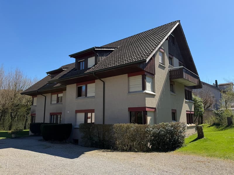 2 story house, brown roof, beige walls, red trims, balcony, driveway