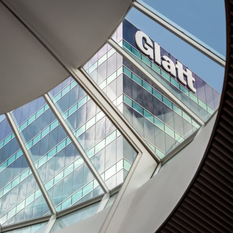 Office building, large glass windows, brand sign 'Glatt'