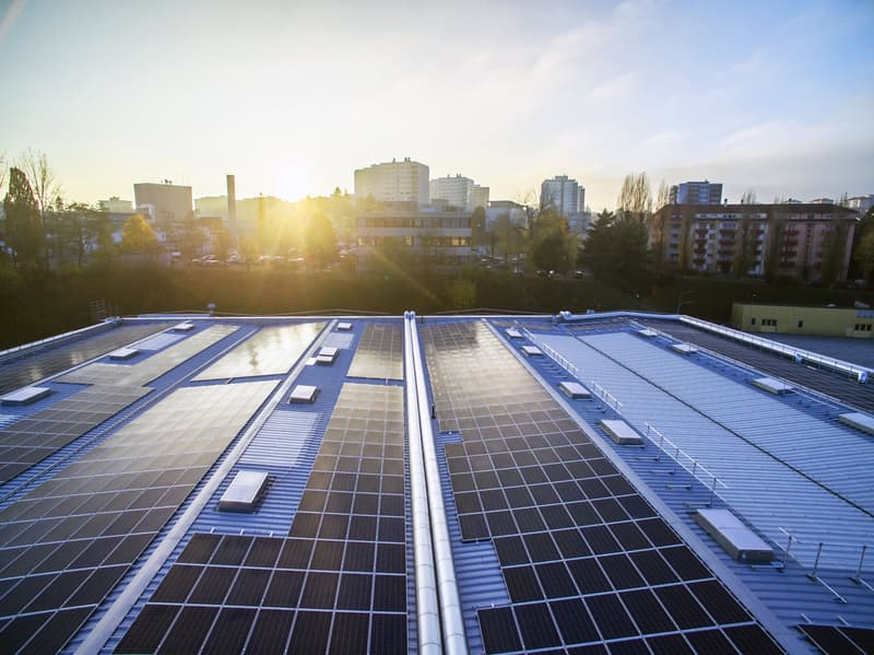 Flat roof with multiple solar panels installed