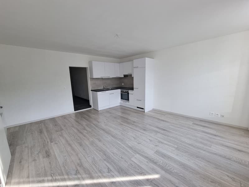 open kitchen, white cabinets, white sink, black countertop, oven, microwave