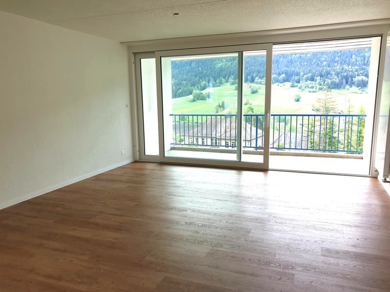 empty room, wooden floor, sliding glass doors, balcony, mountain view