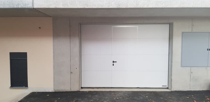 Large garage door, possibly leading to a parking area