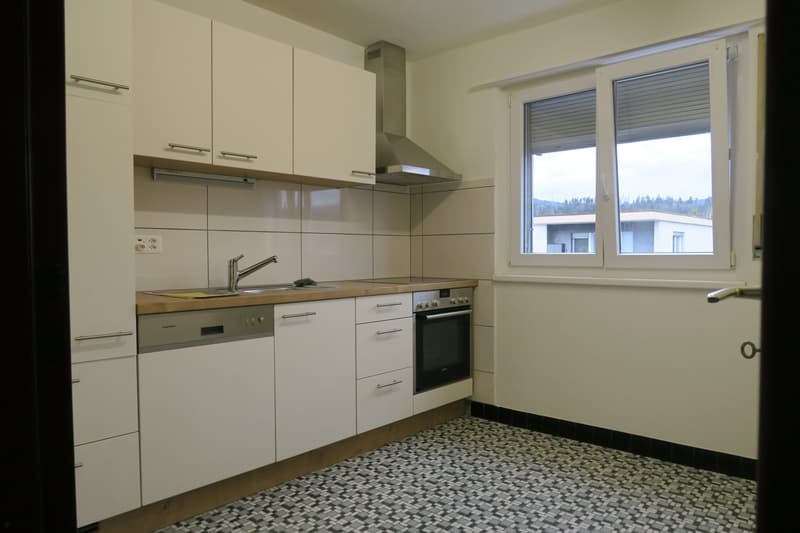 white cabinets, wooden countertop, stainless steel sink, electric oven, dishwasher, power outlets