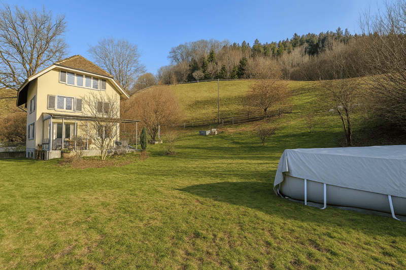 Detached 2 story house, yellow paint, 4 windows on each floor, garden, 1 covered pool