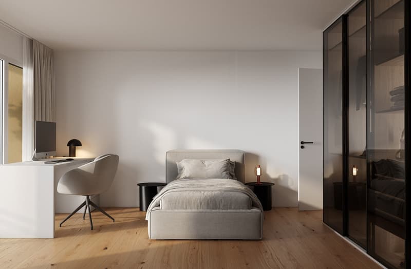 Minimalist bedroom with wooden floor, white walls, bed with nightstands, desk with chair, and monitor