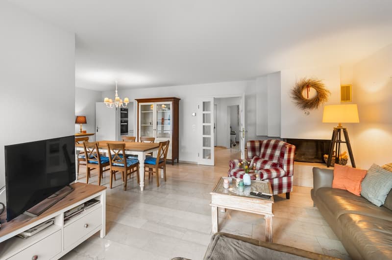 white walls, dining table, chairs, fireplace, chair, sofa, coffee table, television
