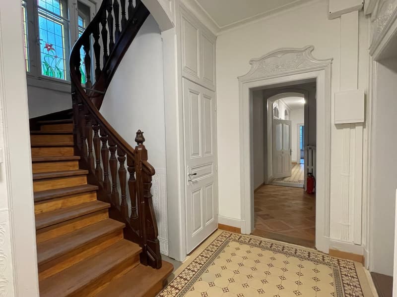 wooden stairs, white painted walls, wooden floor, wooden floor tiles, glass windows, white doors