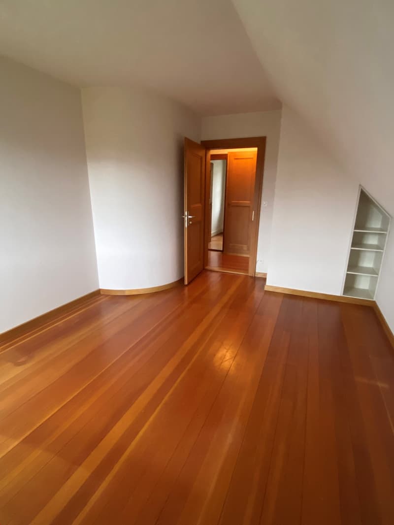 wooden floor, white walls, open doors, corner shelf