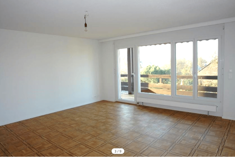 empty room, wooden floor, white walls, large windows, balcony, view of trees