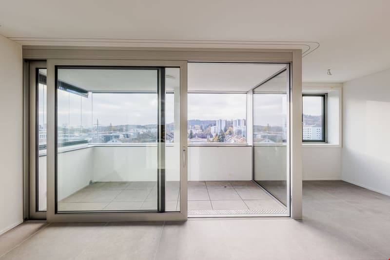 large sliding glass doors, floor to ceiling glass windows, balcony, view to the city
