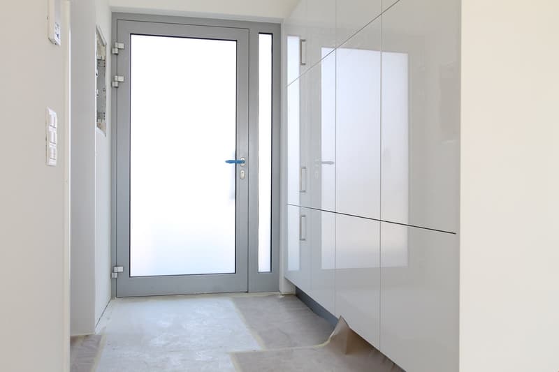 white walls, white floor, glass door, white cabinets