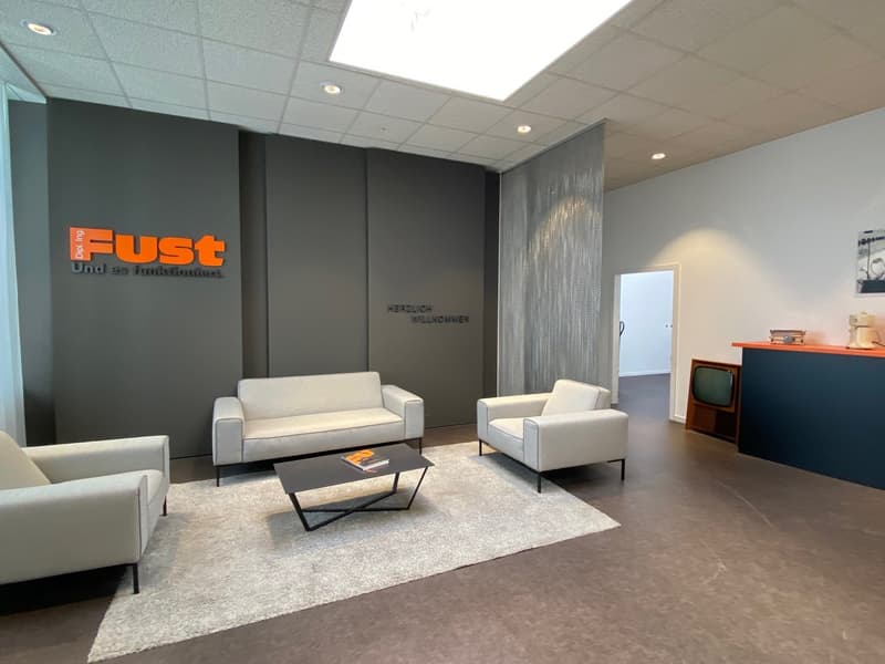 modern interior with gray walls, white furniture, a coffee table, and a carpet on the floor