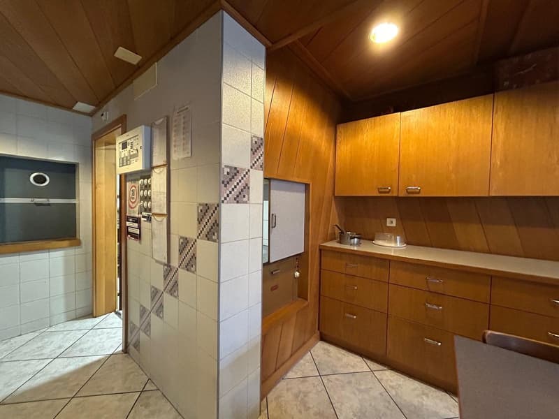 Wooden cabinets, tile flooring, refrigerator, dishwasher