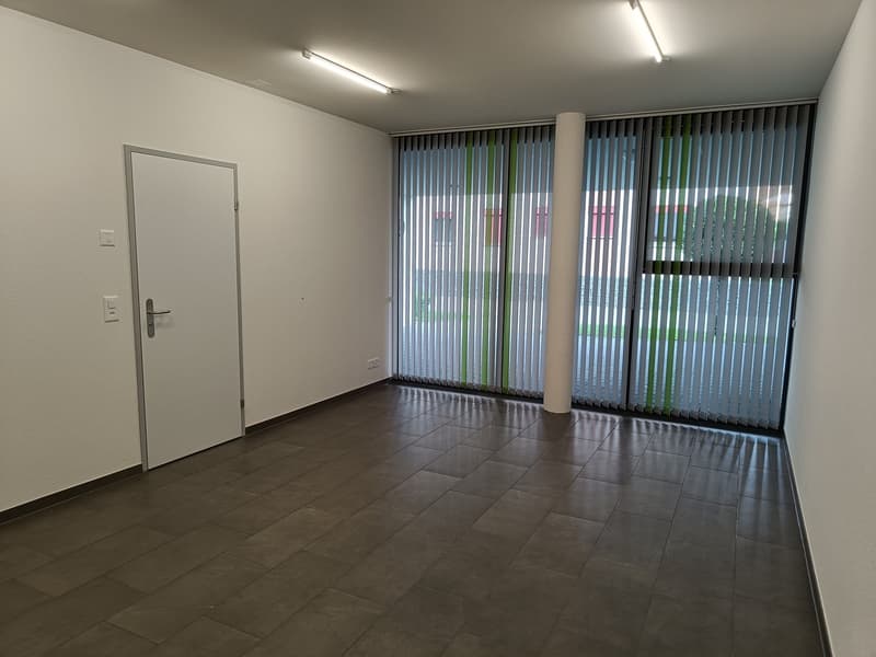 empty room, tile flooring, sliding windows, two lights on ceiling